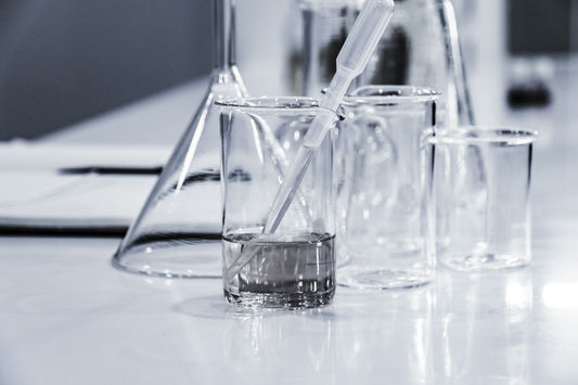 Glass beakers on top of a white lab table