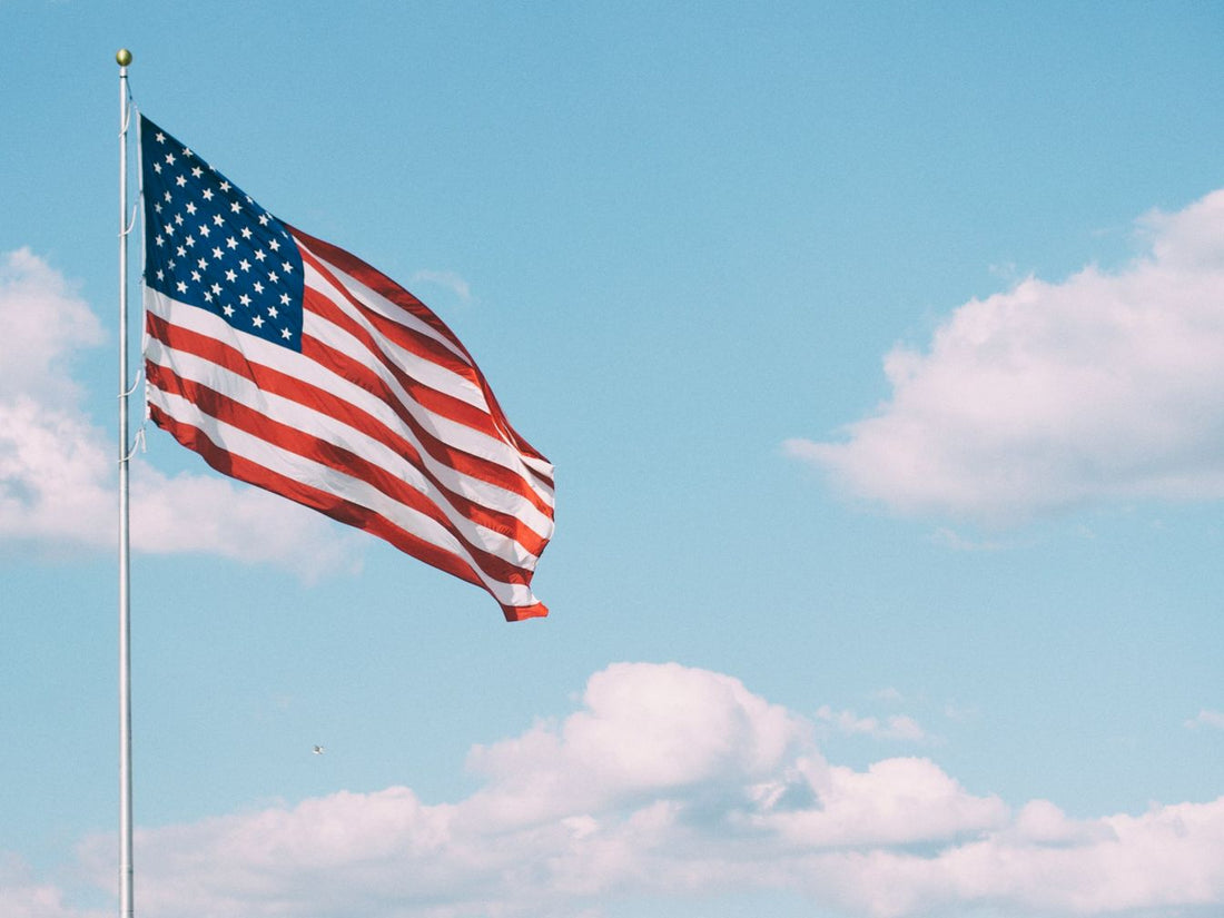 American flag flying on cloudy day