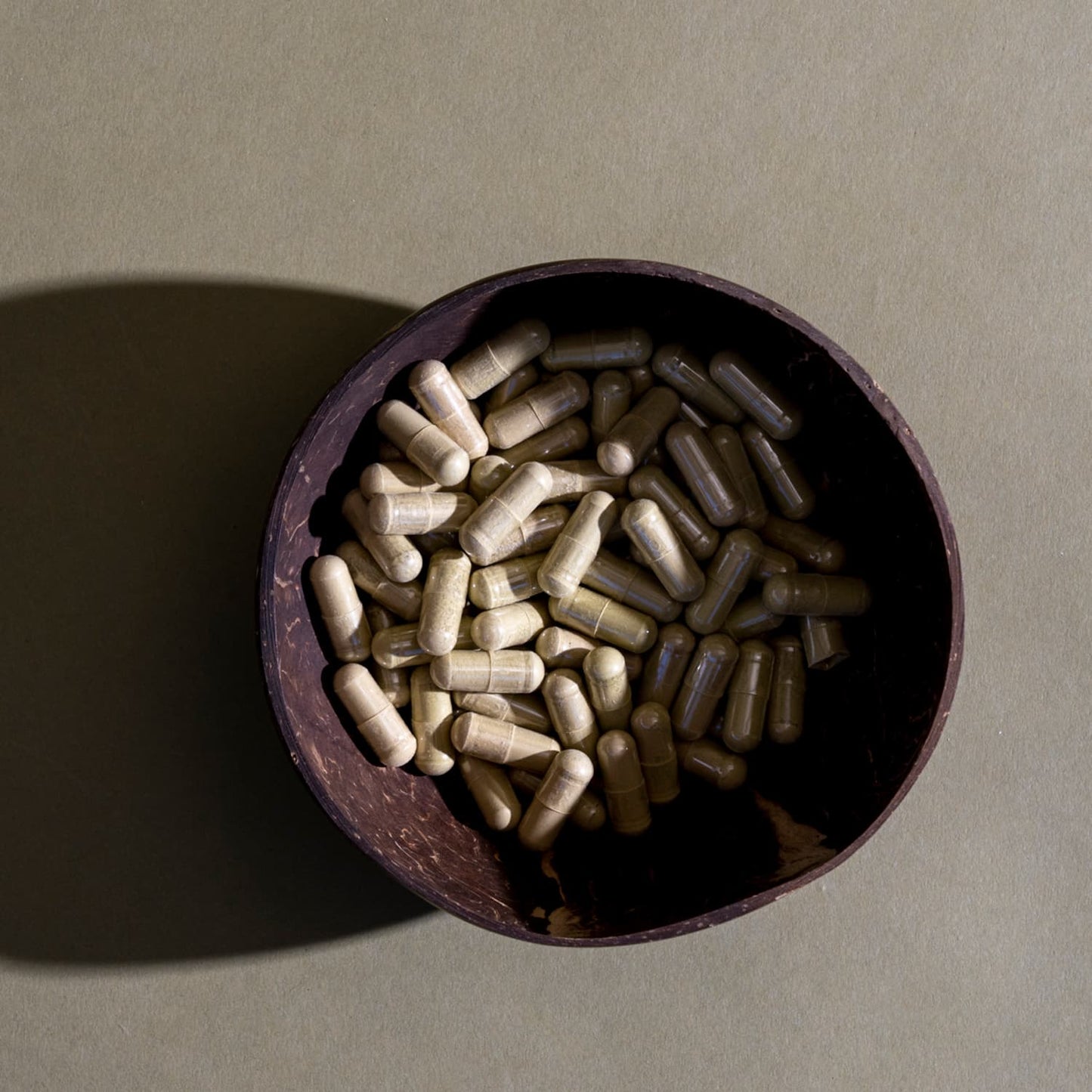 Royal Kratom Thai Kratom Capsules in a bowl